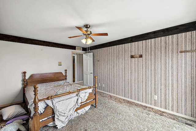 bedroom featuring visible vents, carpet floors, baseboards, and a ceiling fan