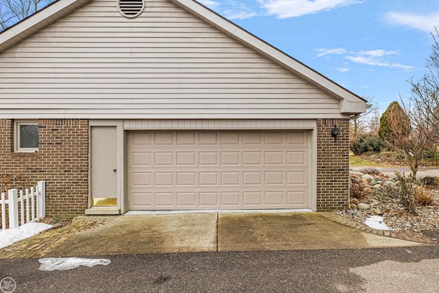 garage with fence