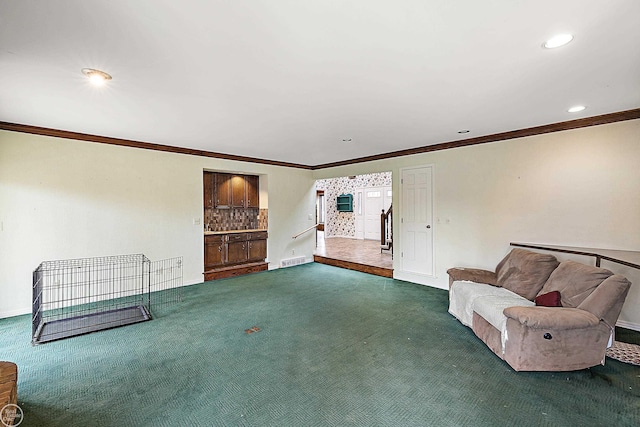 unfurnished room featuring recessed lighting, baseboards, dark colored carpet, and ornamental molding