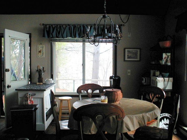 dining area with an inviting chandelier