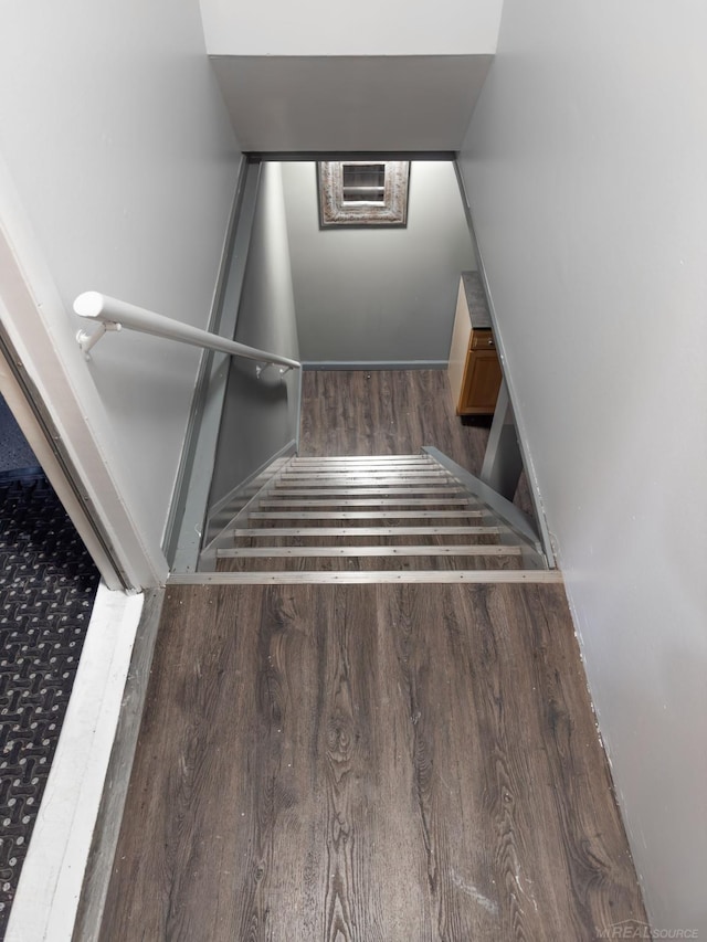 staircase with wood finished floors