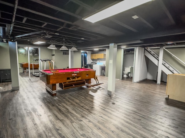 game room with washing machine and clothes dryer, pool table, and wood finished floors