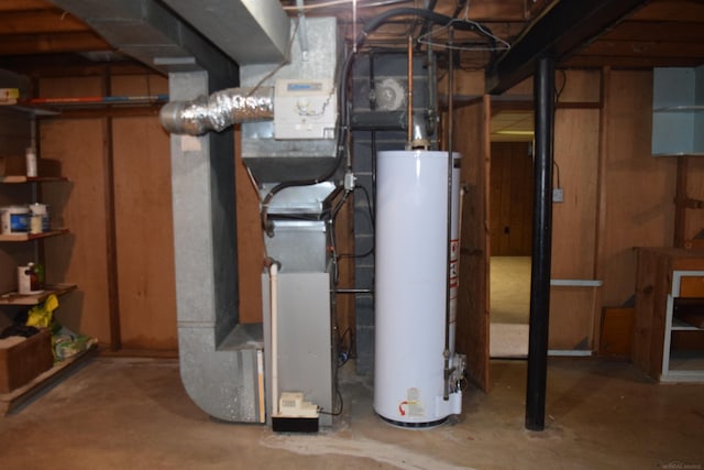 utility room featuring heating unit and water heater