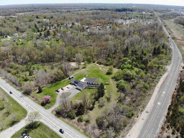 3156 E Maple Ave, Grand Blanc, MI 48507 - aerial overview of property's location with a heavily wooded area