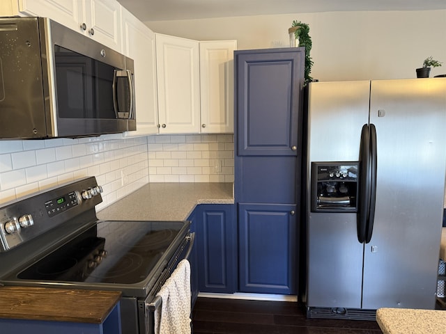 kitchen featuring dark wood-style floors, appliances with stainless steel finishes, white cabinetry, blue cabinets, and backsplash