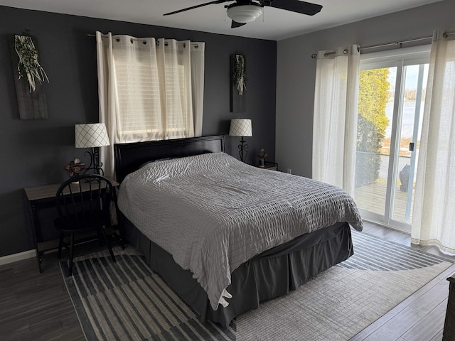 bedroom with a ceiling fan, access to exterior, wood finished floors, and baseboards