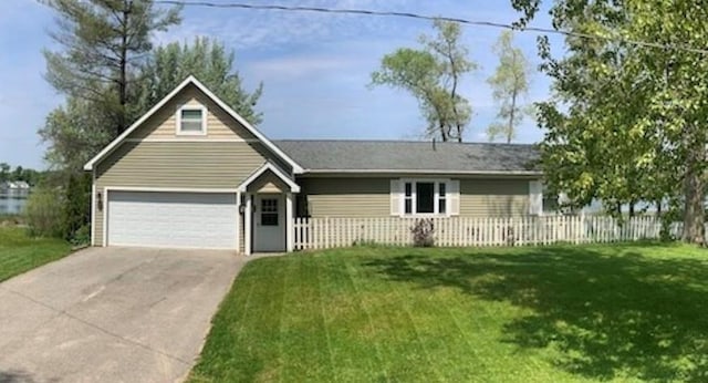 ranch-style home with a garage, concrete driveway, a front lawn, and fence