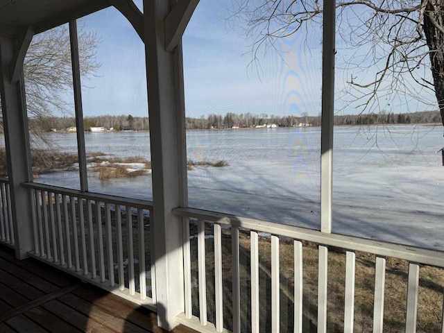 wooden deck featuring a water view