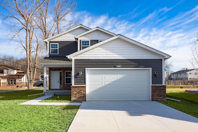 view of front of house featuring brick siding, an attached garage, driveway, and a front yard