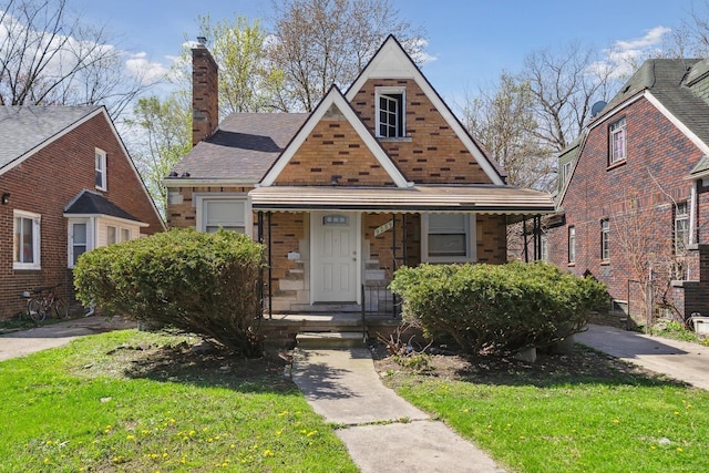 view of front of house featuring a porch and a chimney