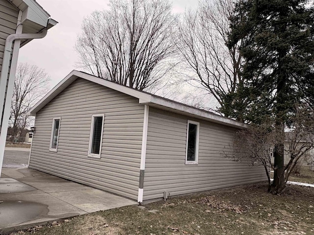 view of side of property with a patio