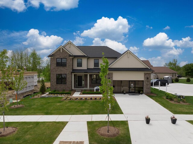 17447 Megan Dr, Macomb, MI 48042 - craftsman-style house with driveway, brick siding, and a front lawn