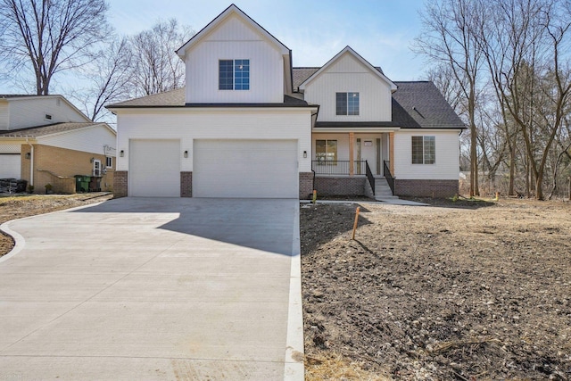 7474 Connies Dr, Shelby Twp, MI 48316 - view of front of house with a garage, brick siding, covered porch, and driveway