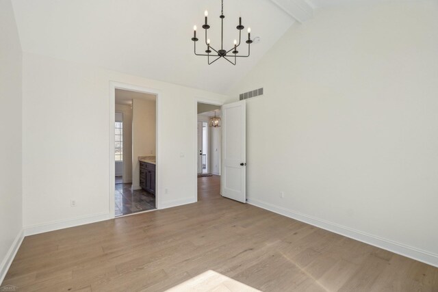 7474 Connies Dr, Shelby Twp, MI 48316 - unfurnished dining area with wood finished floors, visible vents, high vaulted ceiling, an inviting chandelier, and beam ceiling