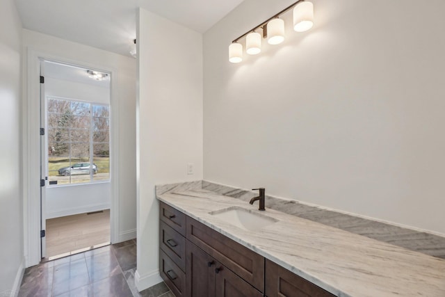 7474 Connies Dr, Shelby Twp, MI 48316 - bathroom with vanity and baseboards