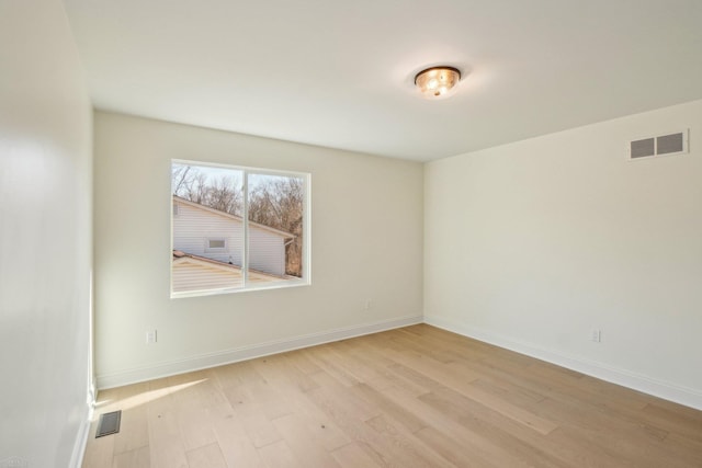 7474 Connies Dr, Shelby Twp, MI 48316 - unfurnished room with light wood-type flooring, visible vents, and baseboards
