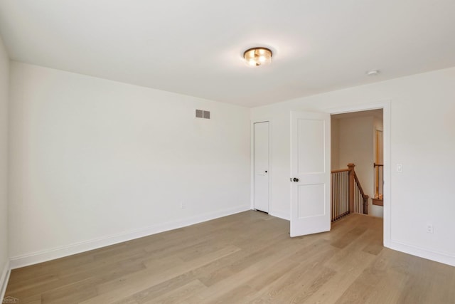7474 Connies Dr, Shelby Twp, MI 48316 - empty room featuring light wood finished floors, visible vents, and baseboards