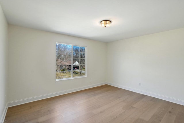 7474 Connies Dr, Shelby Twp, MI 48316 - spare room featuring wood finished floors and baseboards