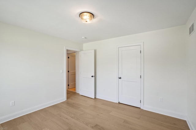 7474 Connies Dr, Shelby Twp, MI 48316 - unfurnished bedroom featuring baseboards and light wood-type flooring