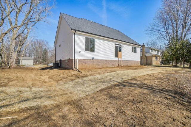 7474 Connies Dr, Shelby Twp, MI 48316 - back of house featuring central air condition unit and fence