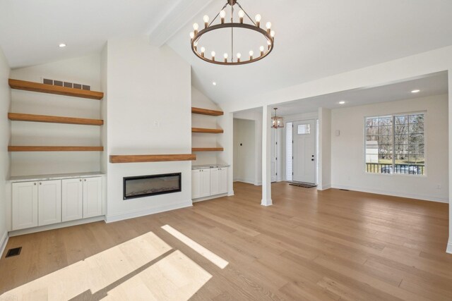 7474 Connies Dr, Shelby Twp, MI 48316 - unfurnished living room featuring a chandelier, visible vents, and light wood-style floors