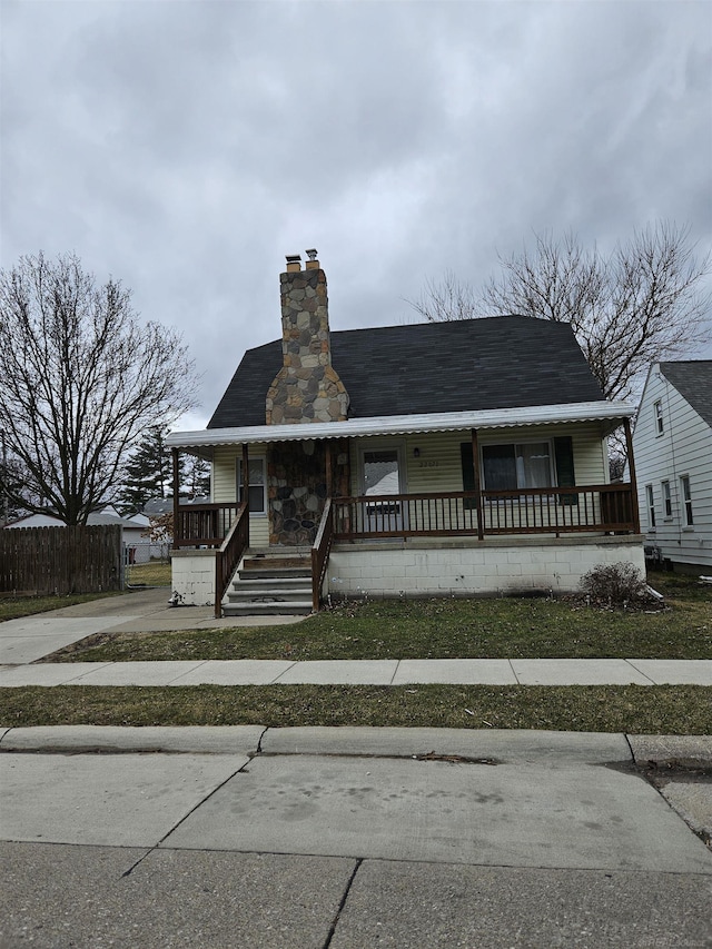 view of front of property featuring a porch and a chimney
