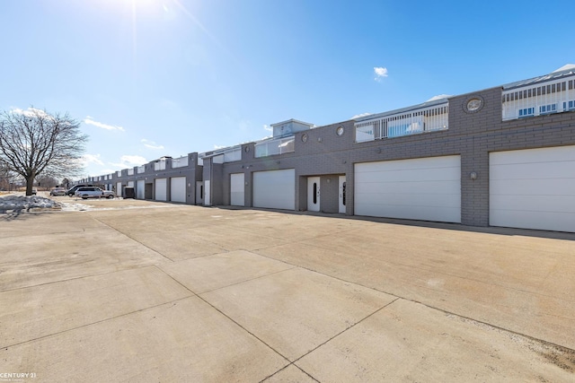 65 Sea Ray Blvd Unit 7, Harrison Twp, MI 48045 - view of property featuring community garages