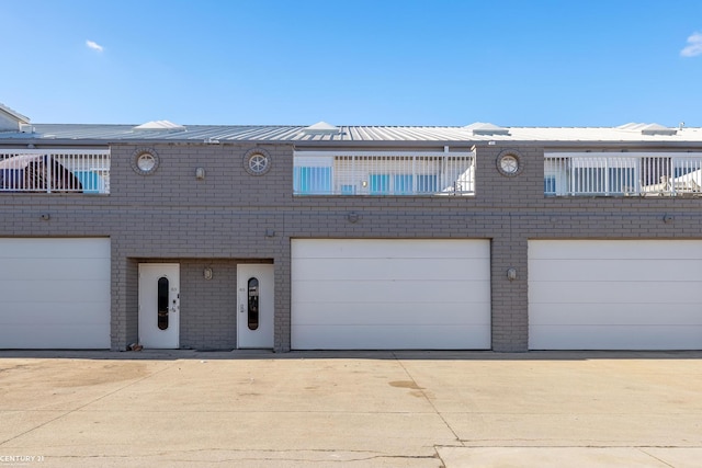 65 Sea Ray Blvd Unit 7, Harrison Twp, MI 48045 - view of front facade featuring brick siding and metal roof