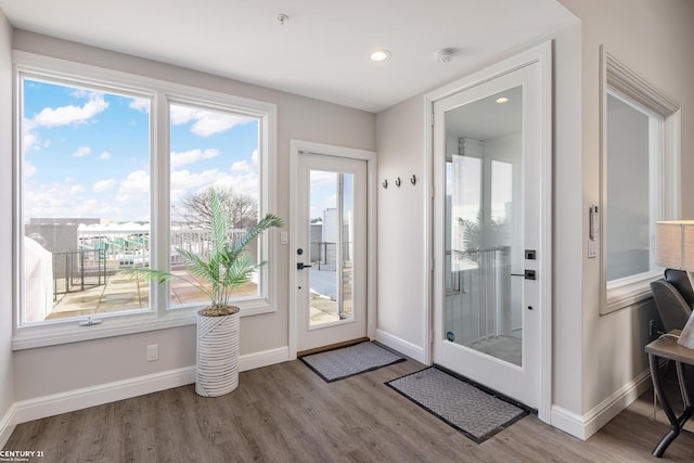 65 Sea Ray Blvd Unit 7, Harrison Twp, MI 48045 - doorway to outside featuring recessed lighting, baseboards, and wood finished floors