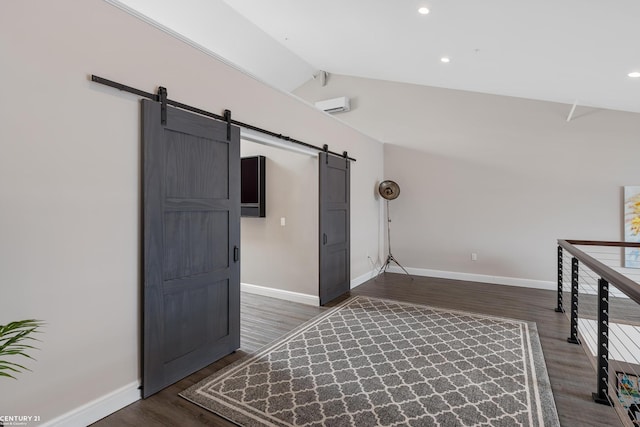 65 Sea Ray Blvd Unit 7, Harrison Twp, MI 48045 - interior space featuring baseboards, dark wood finished floors, an AC wall unit, vaulted ceiling, and a barn door