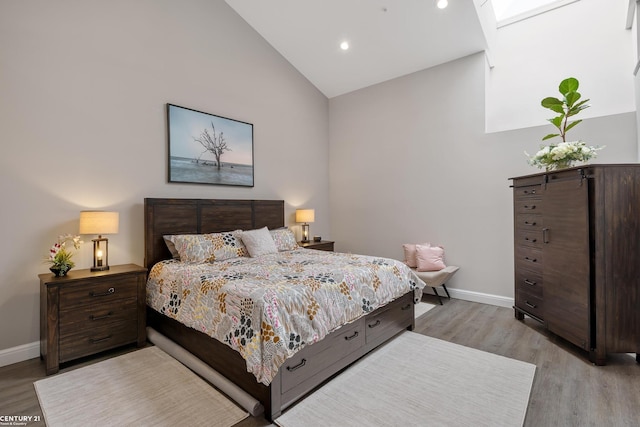 65 Sea Ray Blvd Unit 7, Harrison Twp, MI 48045 - bedroom featuring vaulted ceiling, light wood-style flooring, and baseboards