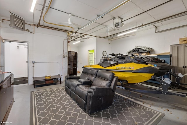 65 Sea Ray Blvd Unit 7, Harrison Twp, MI 48045 - garage featuring a garage door opener and concrete block wall