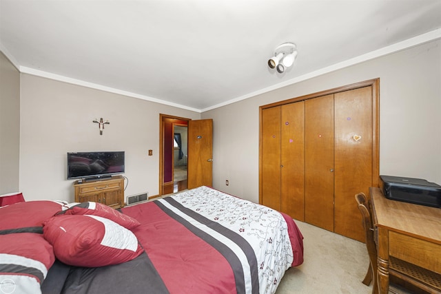 bedroom with light carpet, crown molding, a closet, and visible vents