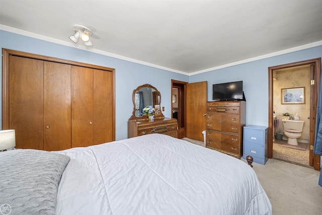 bedroom with light carpet, connected bathroom, and a closet
