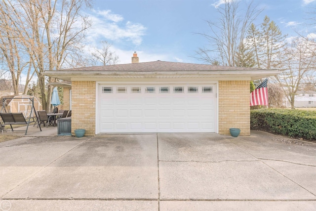 detached garage with a storage shed