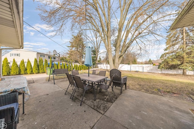 view of patio with a fenced backyard and outdoor dining area