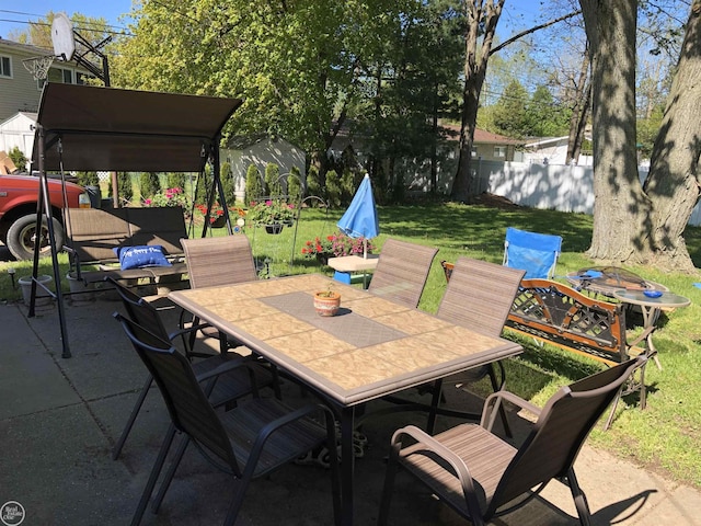 view of patio / terrace featuring fence and outdoor dining space