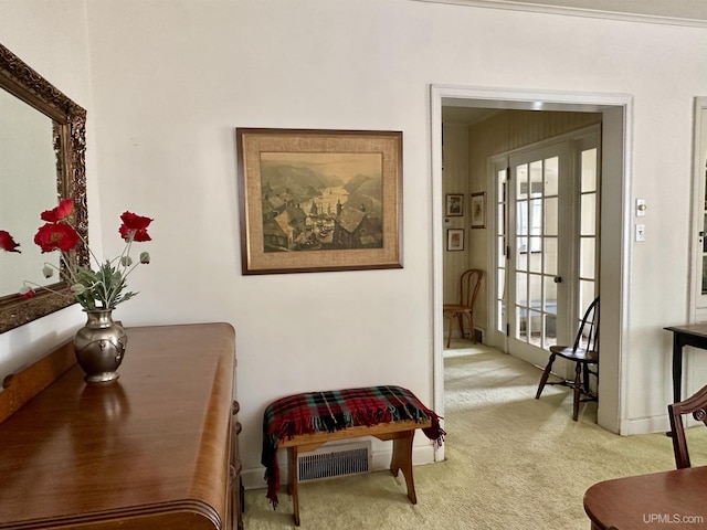 sitting room with baseboards, visible vents, and carpet floors