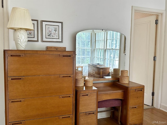 home office with light wood-style flooring