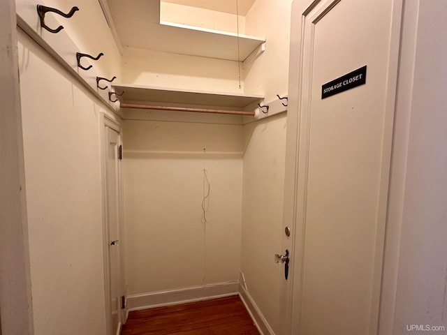 walk in closet featuring dark wood-type flooring