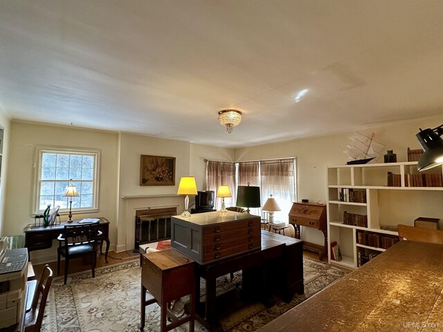 office featuring a glass covered fireplace