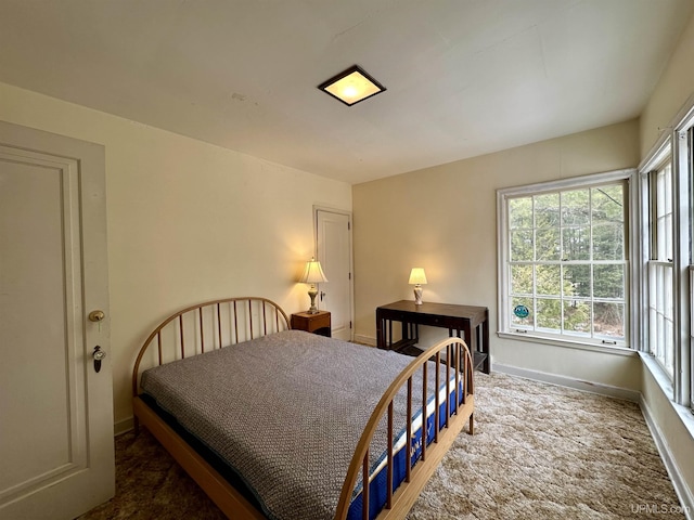 bedroom featuring baseboards