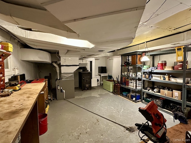 finished basement with a workshop area