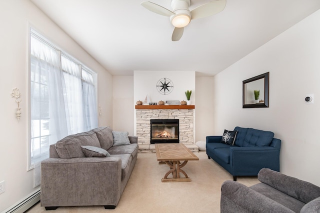 102 Phoxy Ln, Indian River, MI 49749 - living room featuring a ceiling fan, a healthy amount of sunlight, baseboard heating, and light colored carpet