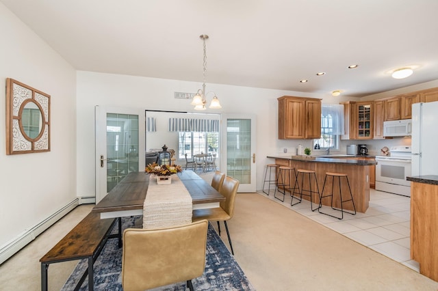 102 Phoxy Ln, Indian River, MI 49749 - dining space with light tile patterned floors, recessed lighting, a baseboard heating unit, and a wealth of natural light