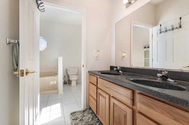 102 Phoxy Ln, Indian River, MI 49749 - bathroom with double vanity, toilet, tile patterned flooring, and a sink