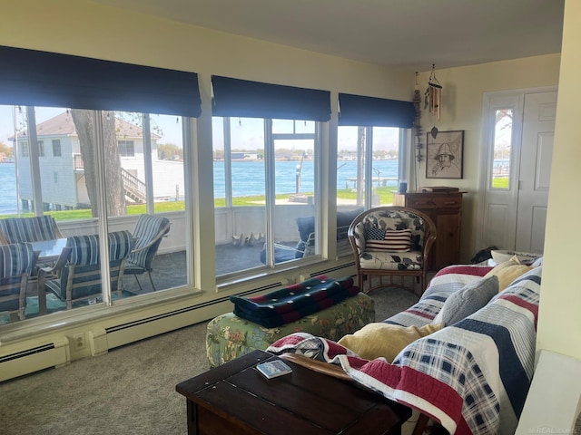 living room featuring a water view and carpet