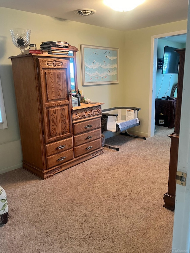 bedroom featuring carpet flooring and baseboards
