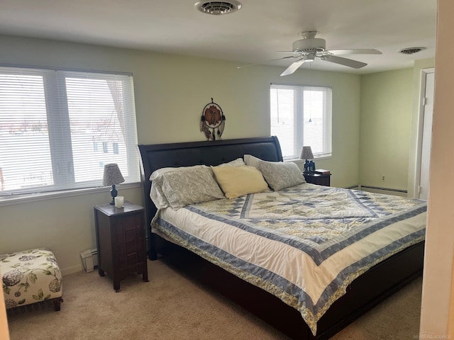 carpeted bedroom featuring baseboard heating, a baseboard heating unit, baseboards, and ceiling fan