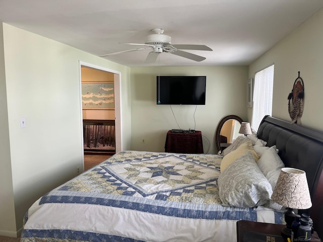 bedroom with ceiling fan and carpet flooring